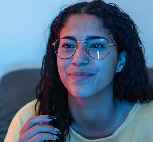 Exceptional Connectivity Photo of a woman with glasses watching Television at home